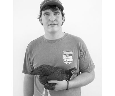 Matt Rahner, "Fair Man, #1, with Chicken," 2017, photograph.
