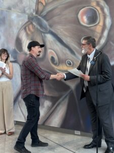 Alex Britton accepting President purchase award for "Have You Seen Me Lately?"