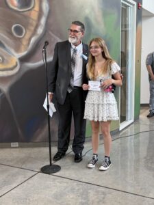 Liz Haugland accepting President purchase award for "The Big Bite".