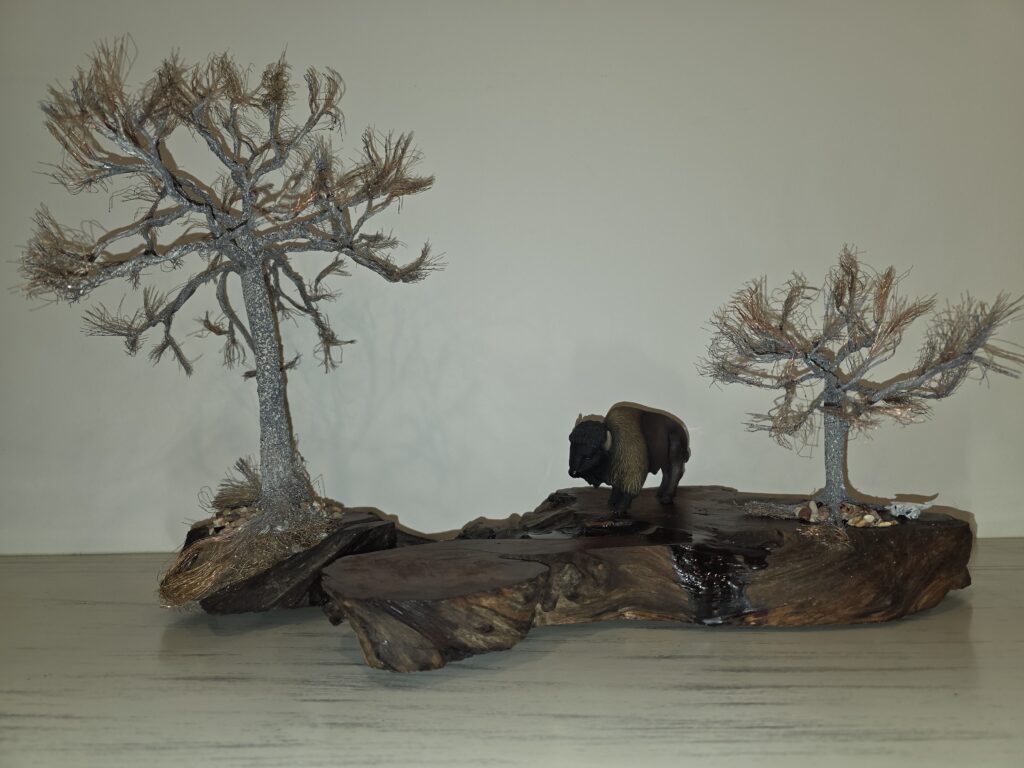 Douglas Kiburz, "Spirit of the Plains", 2026; Aged redwood slab, copper, resin; Courtesy of the artist.