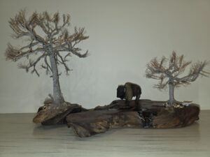 Douglas Kiburz, "Spirit of the Plains", 2026; Aged redwood slab, copper, resin; Courtesy of the artist.
