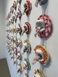 Amy Meissner, "Milk on the Tongue", 2022; Vintage crocheted potholders, embroideries, abandoned crazy quilts, glass and plastic craft beads, swarovski crystals; Museum purchase.